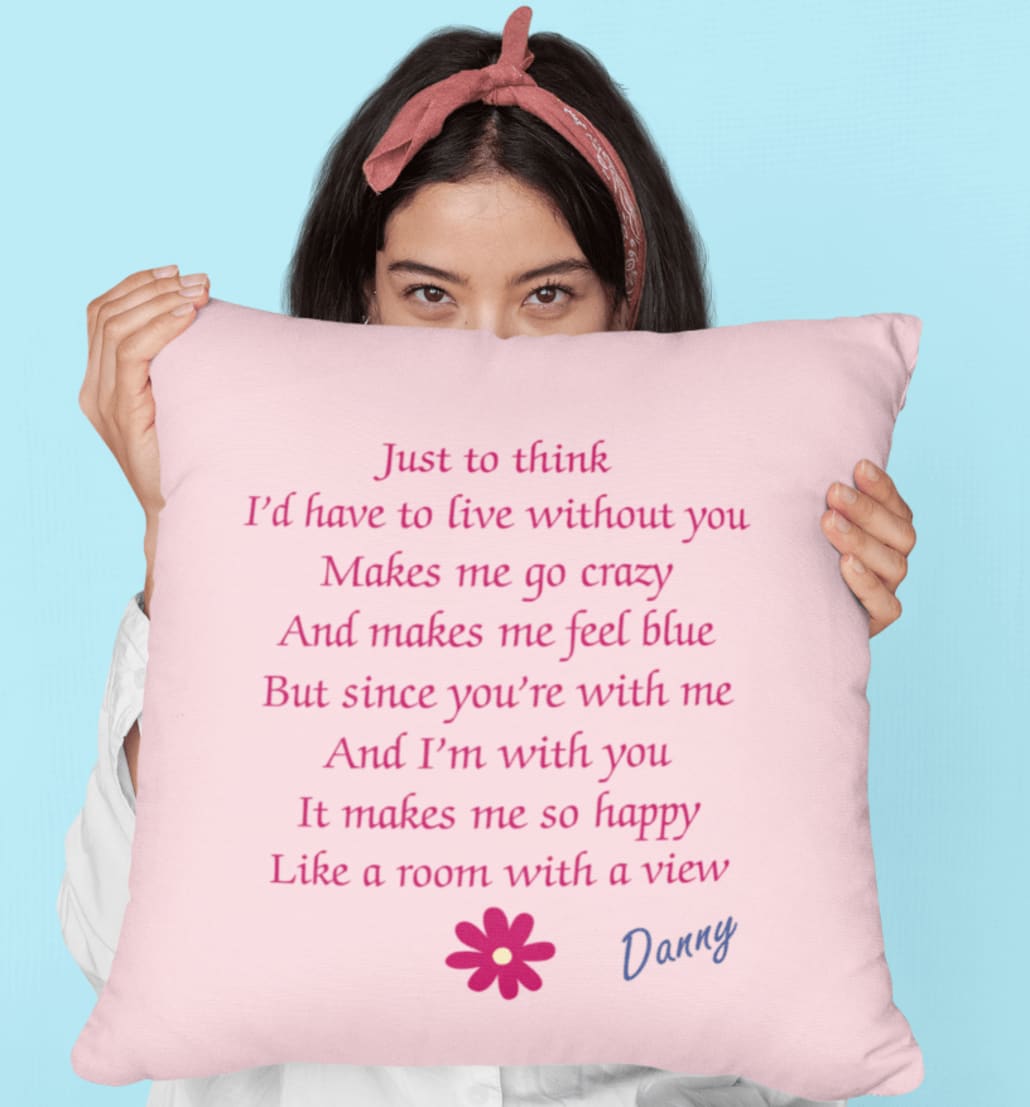 a woman covering her face with a pillow at a studio